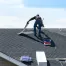 group of workers replacing a damaged shingle roof