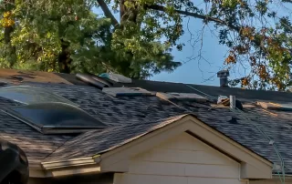 roof hail storm damage being repaired
