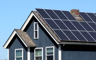 Residential home featuring solar panels.