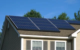 Solar panels on a residential shingle roof.