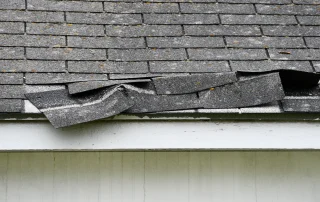 A roof damaged by a storm.