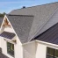 Home with asphalt and metal roofing.